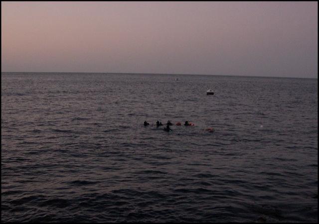 Instructors and Advanced class preparing for a night dive.